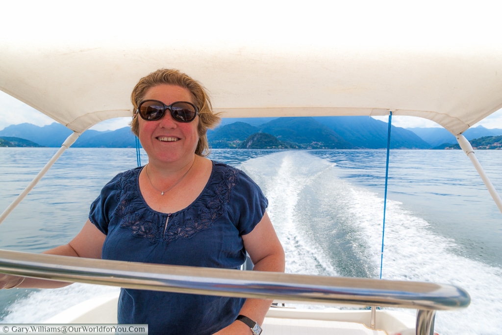 Janis zipping up Lake Como, Italy in a powerboat
