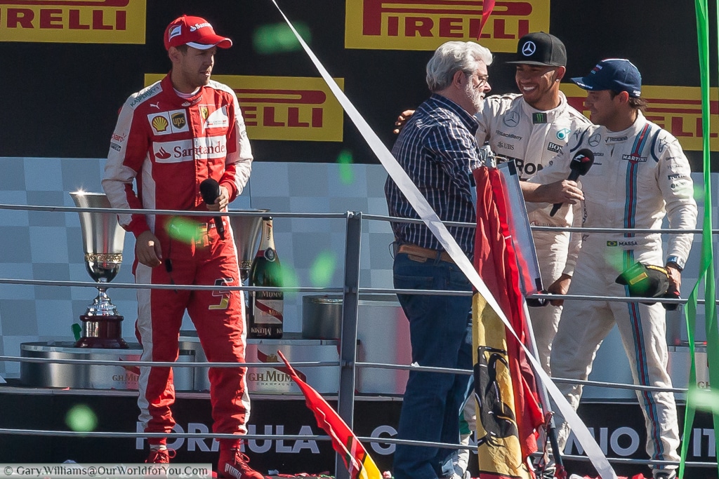 Lewis Hamilton, Felipe Massa, Sebastian Vettel & George Lucas, on the podium at the end of the 2015 Italian Grand Prix in Monza, Italy