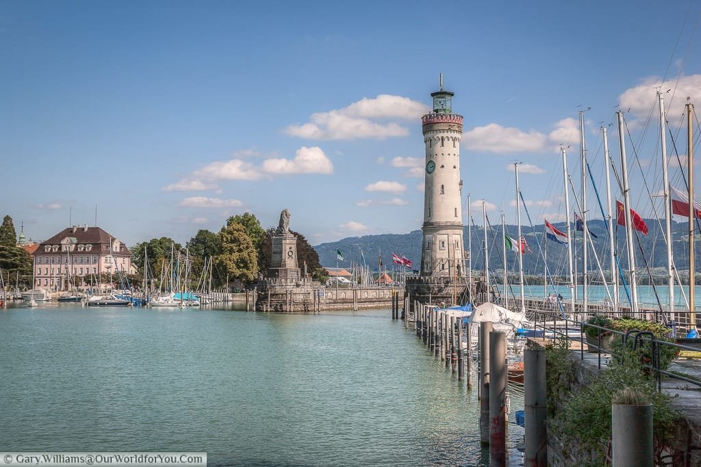 The Lighthouse & Lion Statue flank the harbour of Lindau Island on Lake Constance or Bodensee, Germany.