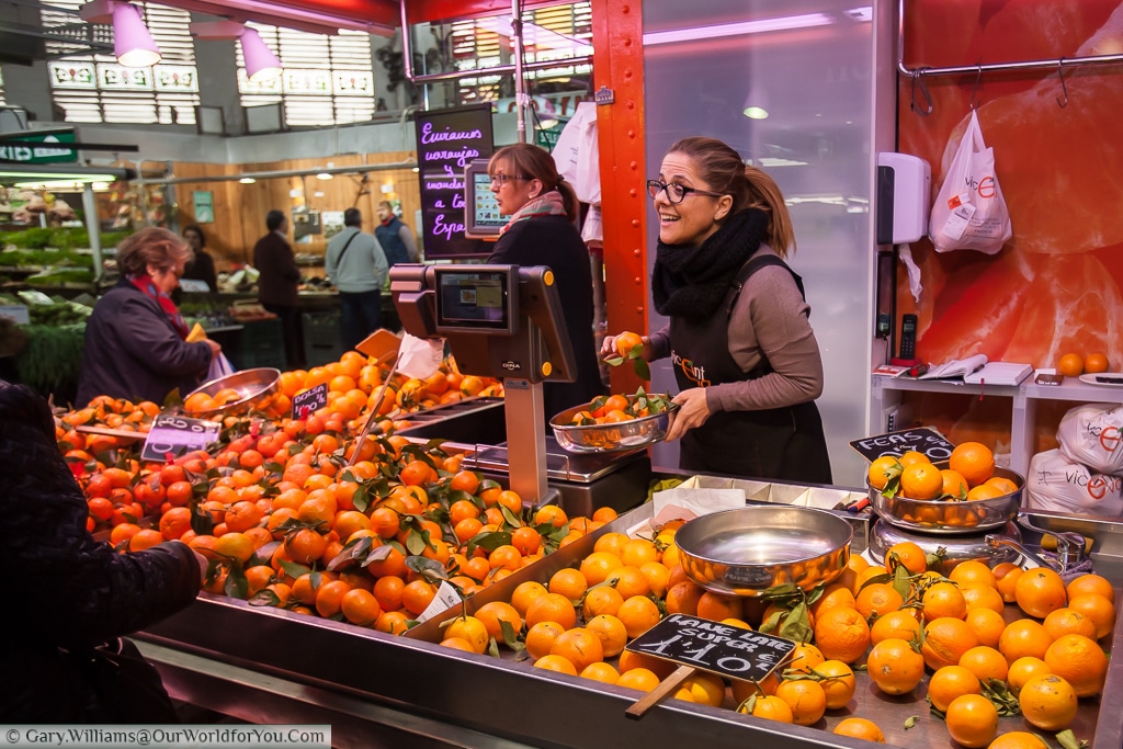 An Orange seller in the Mercado Central, Valencia, Spain