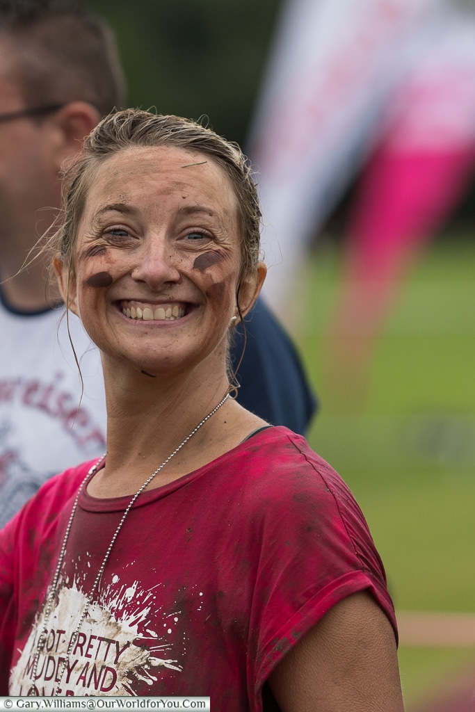 All smiles after the Pretty Muddy Cancer Research event, Cardiff, UK