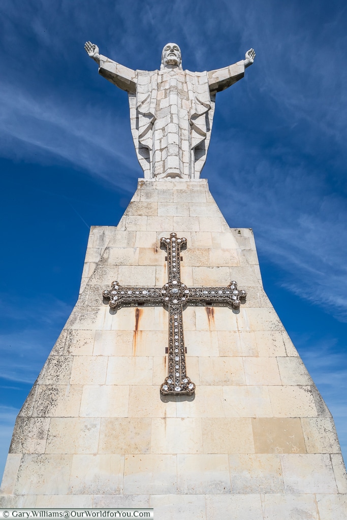 Looking up at the statue of Christ on Mount Naranco, Oviedo, Spain