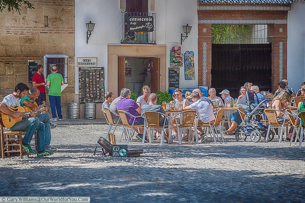 Sitting outside a bar in Plaza Duquesa de Parcent, Ronda, Spain