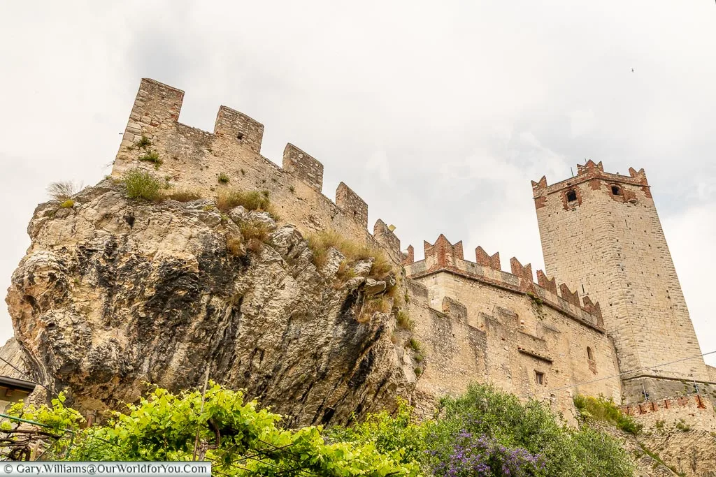 Looking up at Castello Scaligero from a lane below.