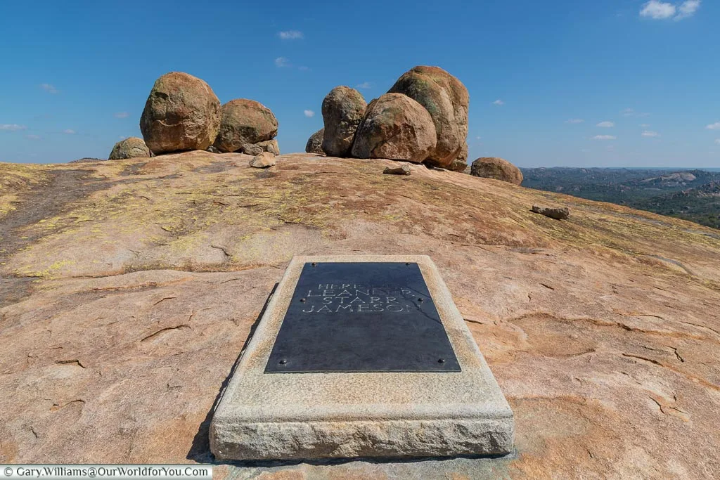 The burial site of Leander Starr Jameson, marked by a brass plaque mounted on a stone.
