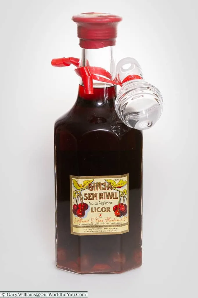 A single bottle of Ginjinha, in which you can clearly see the cherries in the bottom of the bottle, brought back from Lisbon, Portugal
