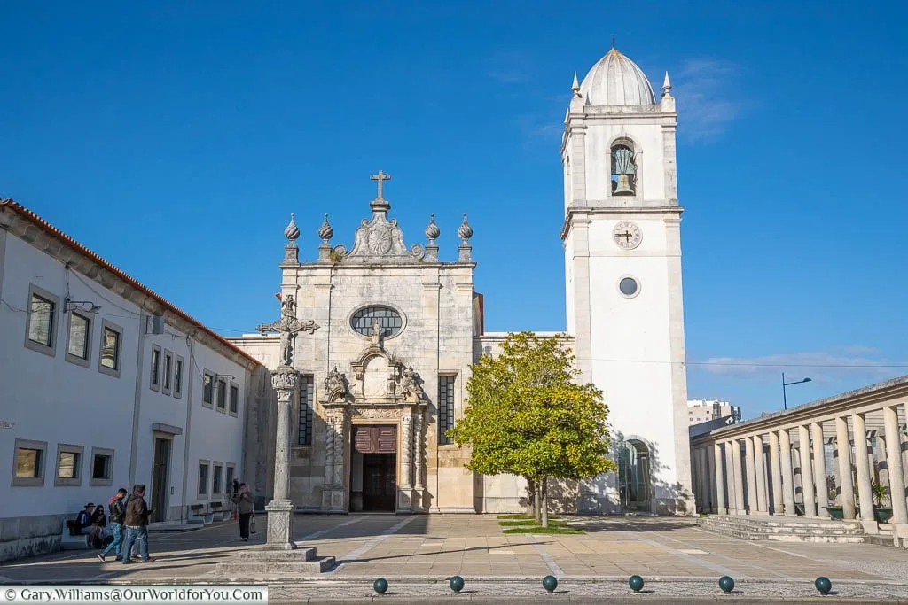 The dominant white tower and the ornate entrance of the Portuguese Baroque styled Aveiro's Cathedral