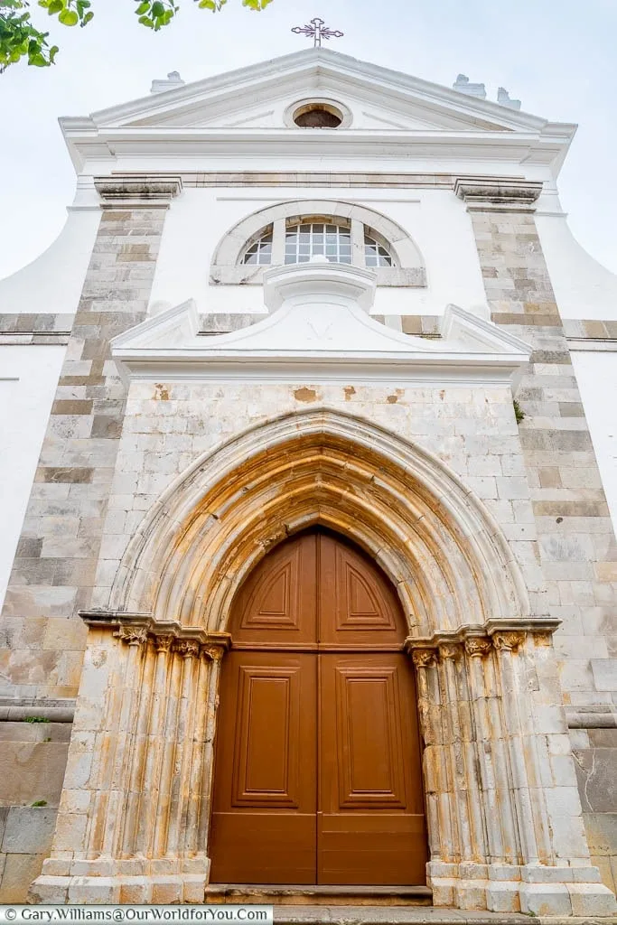 The massive door to the church of Santa Maria do Castelo in Tavira on Portugal's Algarve Coast.