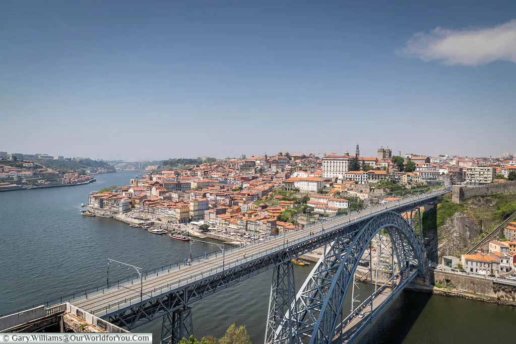 Looking across from the Miradouro da Serra do Pilar over the massive iron Luís I Bridge over the Douro River to the old town of Porto