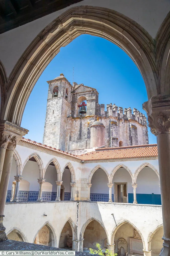 The tower of the Convent of Christ in Tomar framed in one of the arches from the Washing Cloister