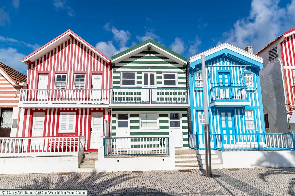 The striped brightly coloured beach homes of Costa Nova on the Portuguese Coast.