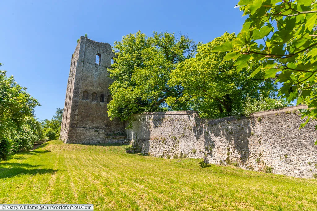 Looking up the grassy bank to the wall and remains of St Leonards Tower on the outskirts of West Malling