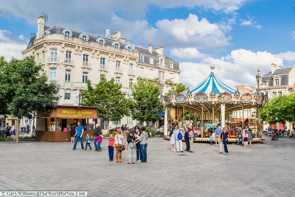 Families gathered in the Place Alexandre Israël in front of the carousel in Troyes, France