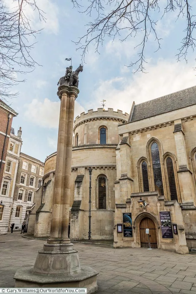 A column, topped with a Knight Templar, in front of the Templar Church in London's legal district
