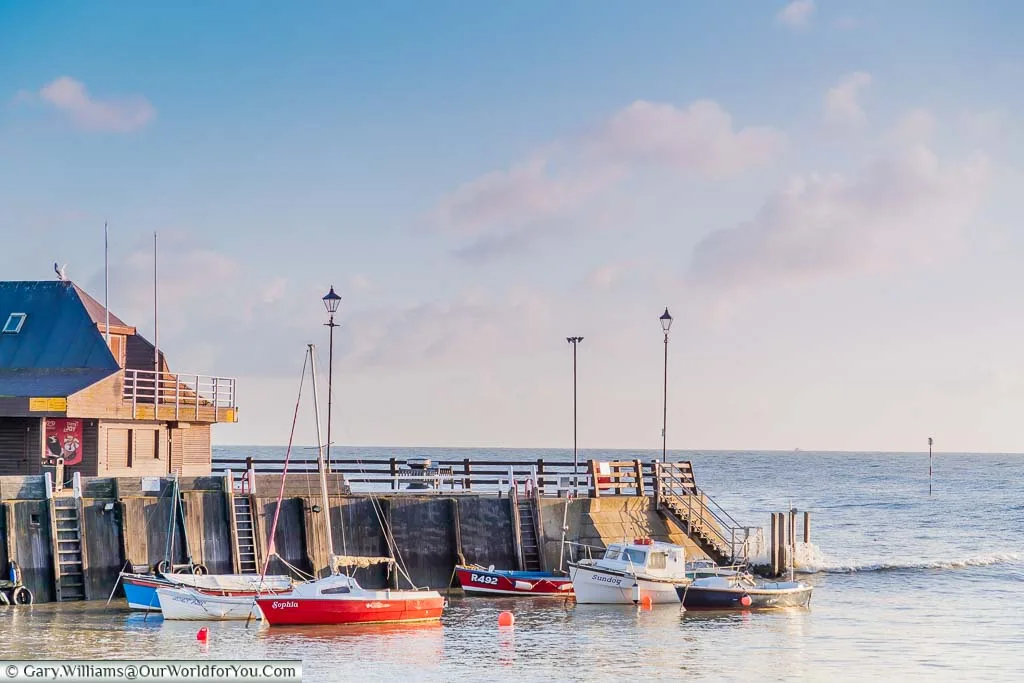 Litlle sailing boats at anchor in Broadstairs harbour on a bright sunny day