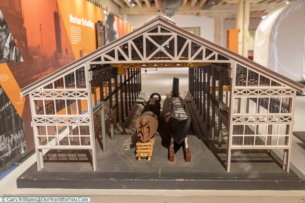 A model of a submarine inside a slip inside the Steam, Steel and Submarine exhibition at the Historic Dockyard Chatham