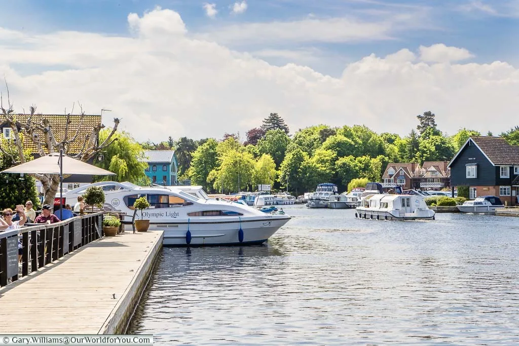 Pleasure boats navigating the Norfolk Broads at Wroxham, Norfolk