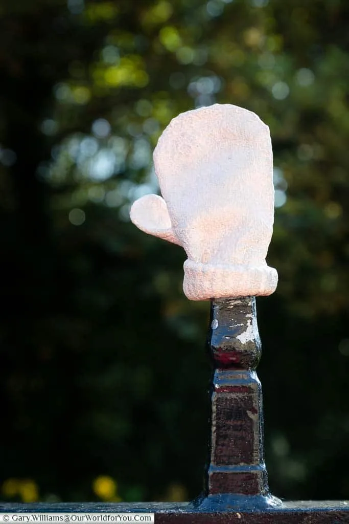 Baby Things by Tracey Emin. A cast metal model of a baby glove attached to the iron railings of the Bayle Pond in Folkestone, Kent