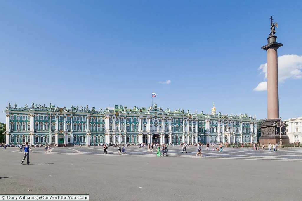 The green and white exterior of the Hermitage Museum Palace Square with the Hermitage Museum, or Winter Palace, from across Palace Square in Saint Petersburg, Russia
