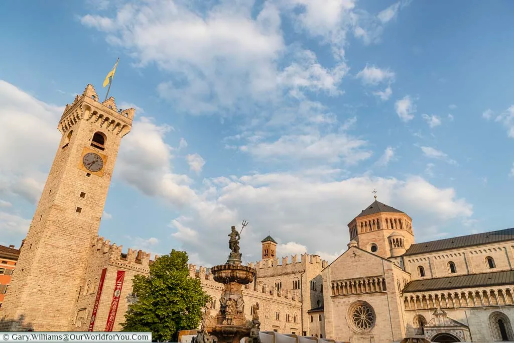 A view from Piazza Duomo of Palazzo Pretorio, the Neptune fountain and the Cattedrale di San Vigilio.