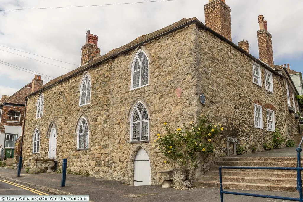 A historic stone 'Centuries House' on Bartholomew Street, Hythe