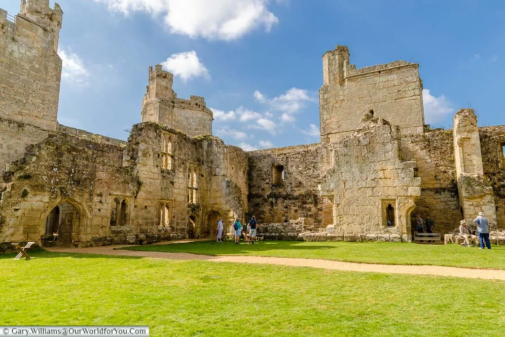 Inside the ruins of Bodiam Castle, looking at its mighty stone walls
