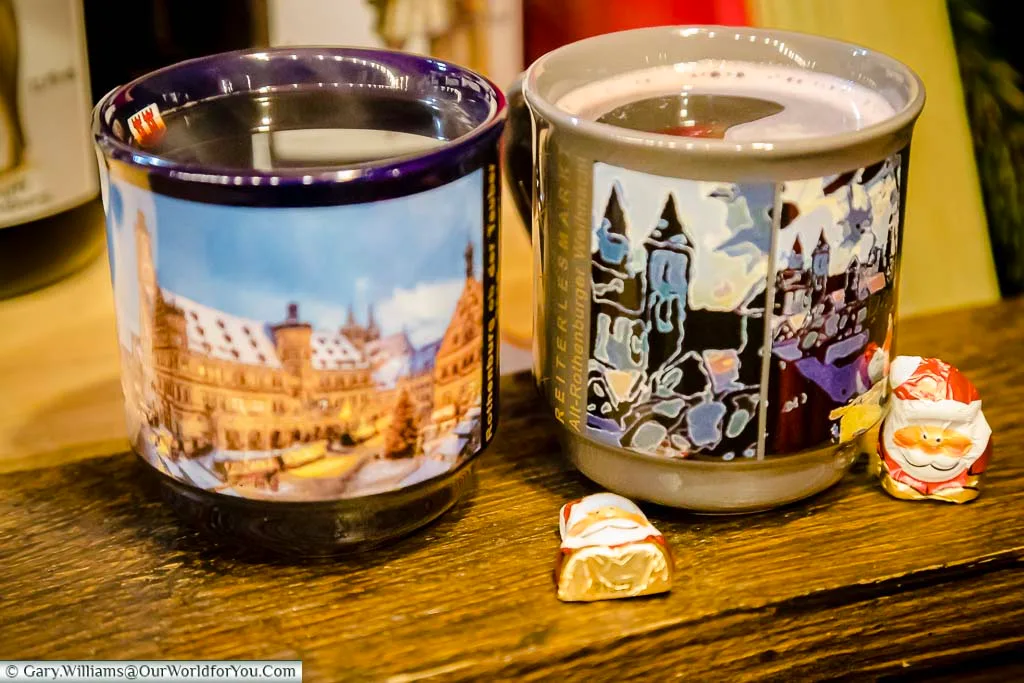 Two mugs of glühwein on Rothenburg ob der Tauber's Christmas Market.
