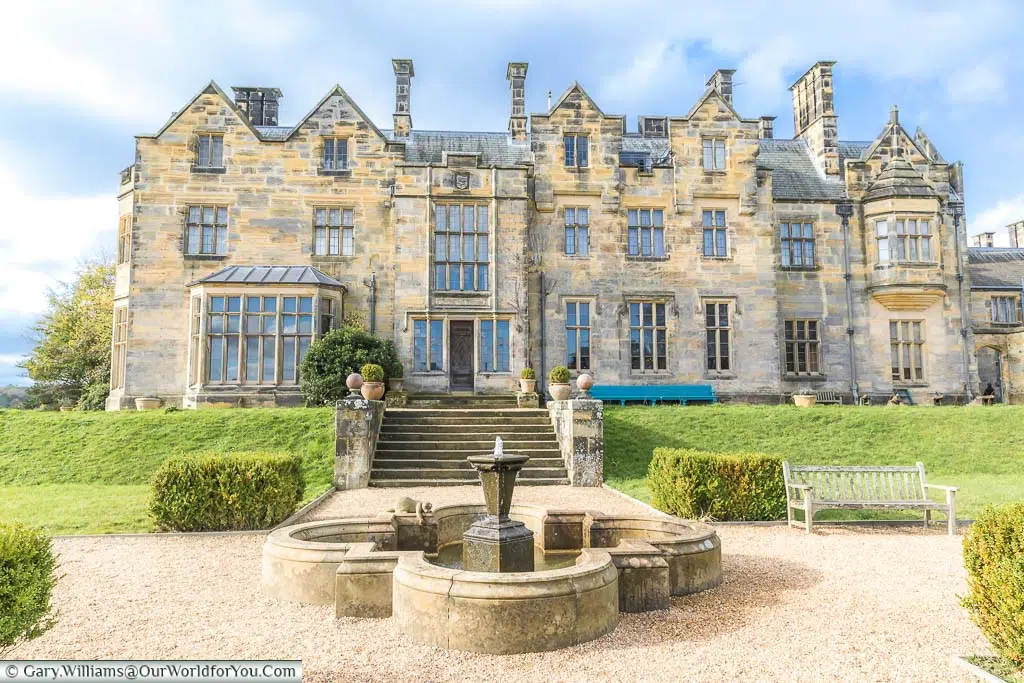 The ornamental fountain in front of the rear side of Scotney House