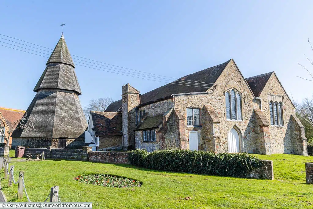 The three-tiered spire stands next to the Church of St Augustine in the village of Brookland on the Romney Marsh in Kent