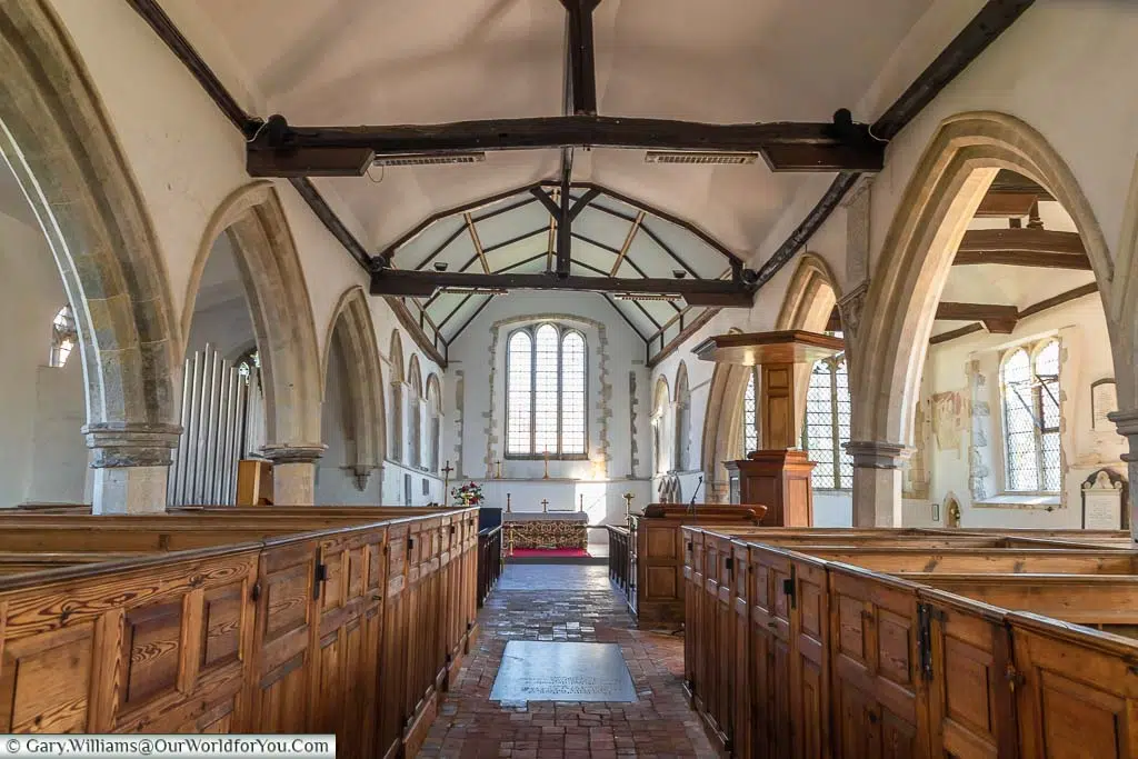 The wooden box pews inside the Church of St Augustine in the village of Brookland on the Romney Marsh in Kent