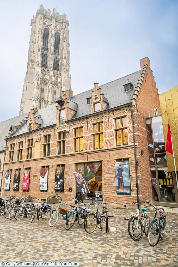 Bikes outside of the Het Kunstuur gallery in Mechelen with Saint Rumbold’s Tower in the background.
