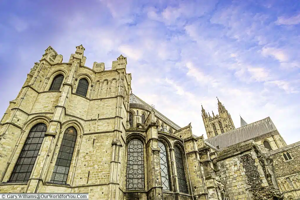 The crypt end of Canterbury Cathedral under a dusky sky.