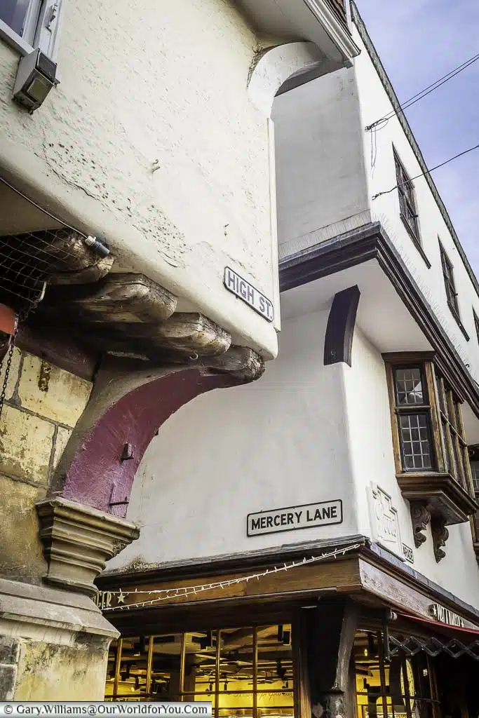 A close-up of the historic gabled buildings of High Street & Mercer Lane in Canterbury