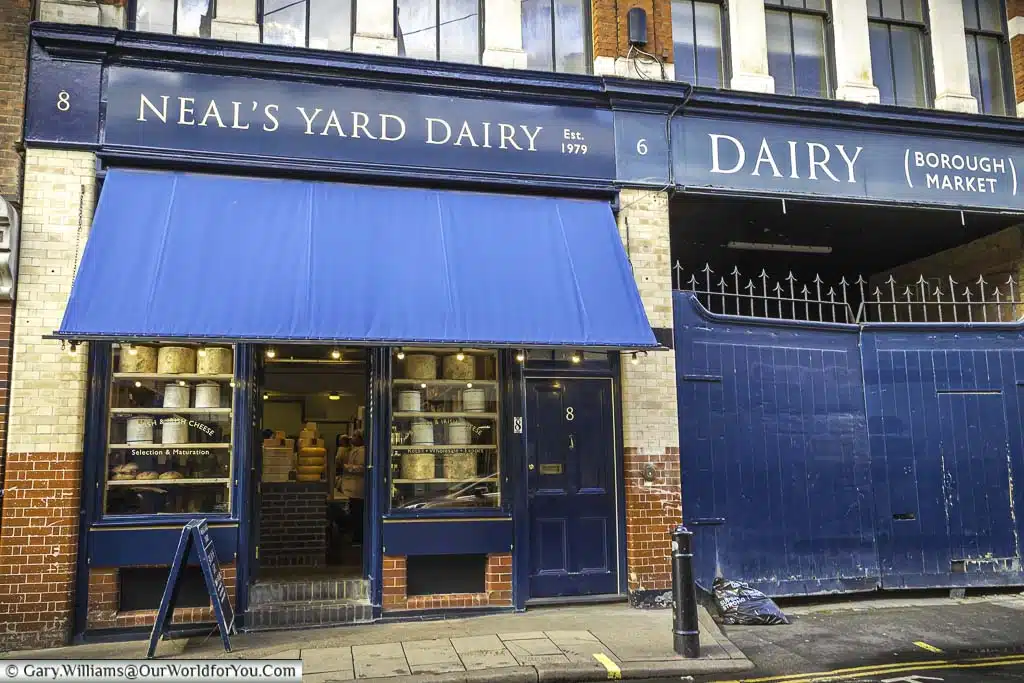 The iconic blue colours adorning the neal's yard dairy store on park street behind london's iconic borough market