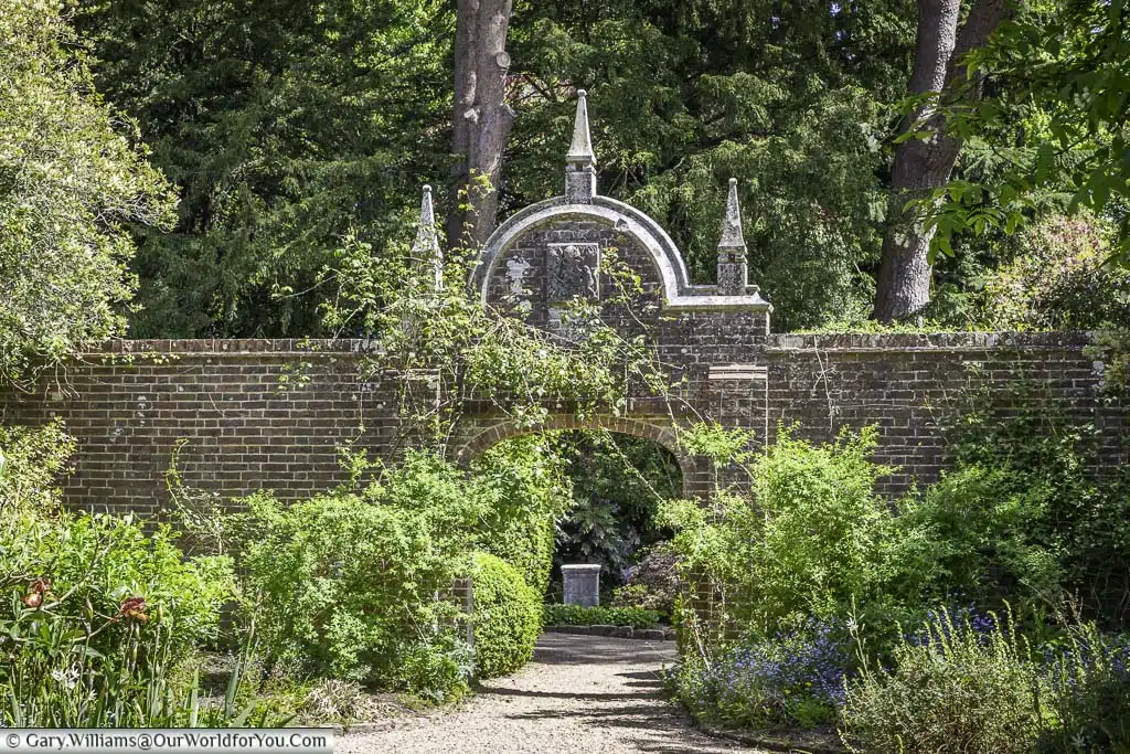 One of the entrance arches to the walled garden at nymans house and gardens in west sussex