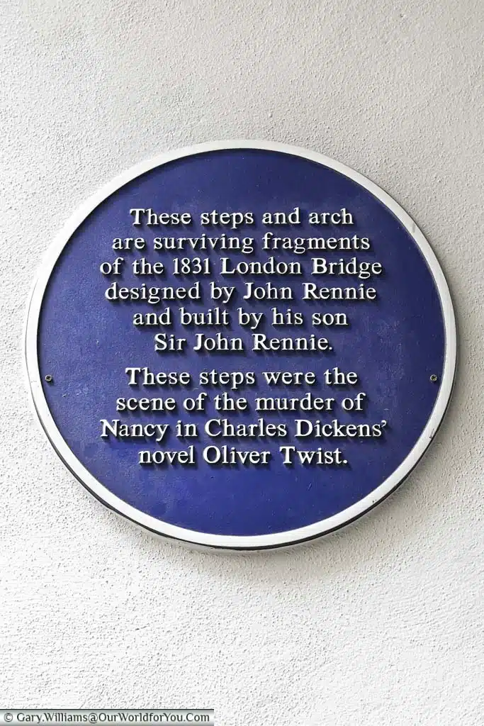 A blue plaque underneath the south arch of London bridge, part of the 1831 london bridge, indicating it's historical importance to bankside