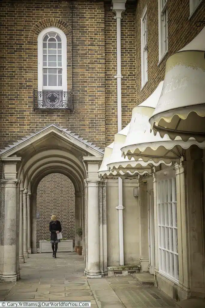 The neoclassical arch on Burgate (Street) leading to its brick-built collonade