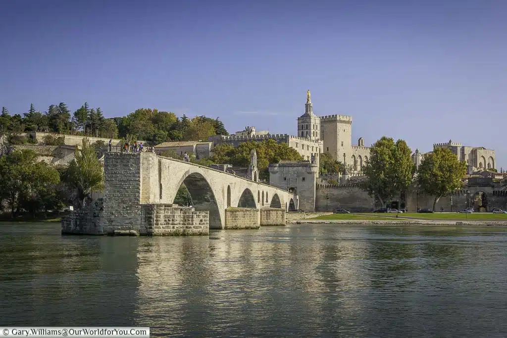 A view across the Rhône river to the remains of the Pont d’Avignon and the Palais des Papes in the background.