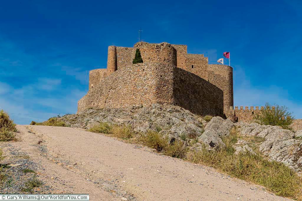 Up close to the ancient consuegra castle atop a ridge in la mancha, spain