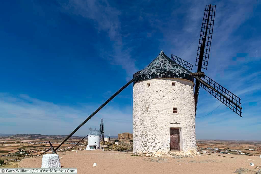 An ancient white windmill in consuegra named espartero, set high above the landscape of la mancha, spain