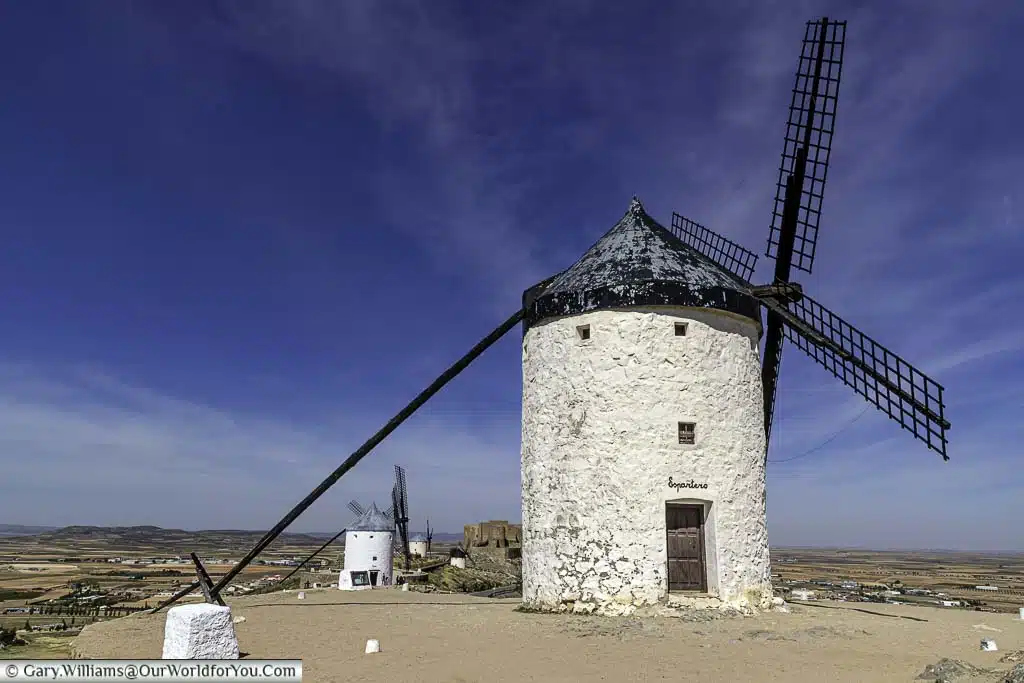 An ancient white windmill in consuegra named espartero, set high above the landscape of la mancha, spain