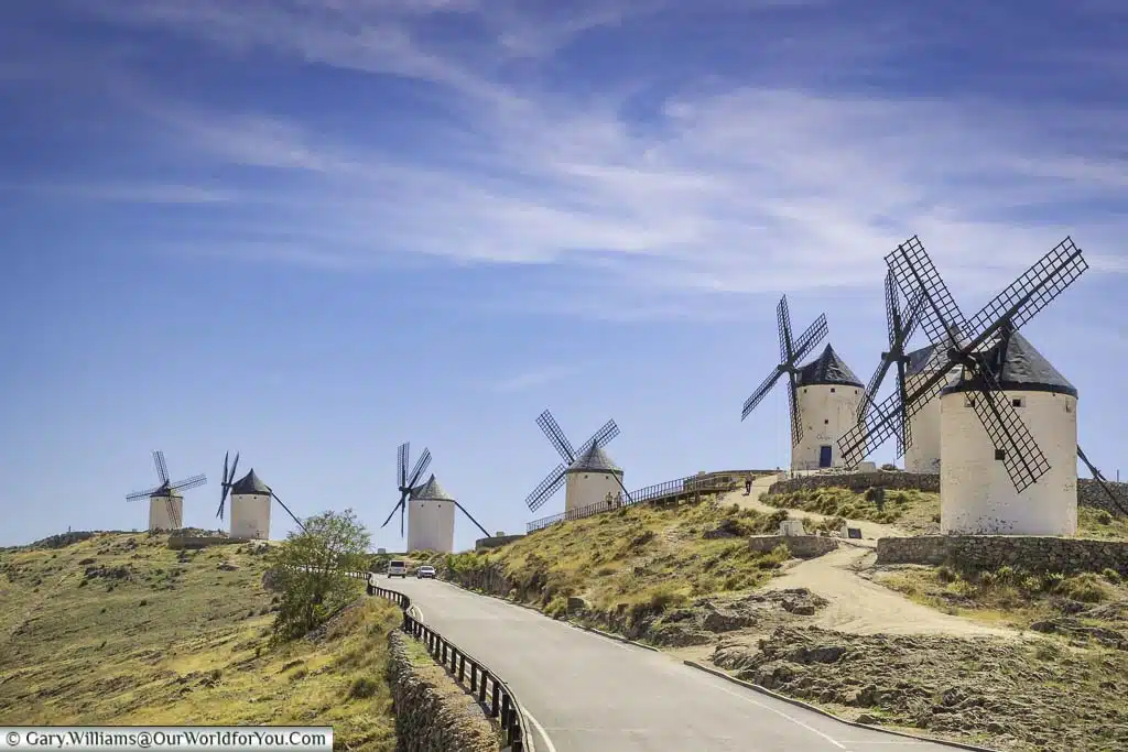 The long, uphill road at Consuegra lined by seven ancient windmills of La Mancha