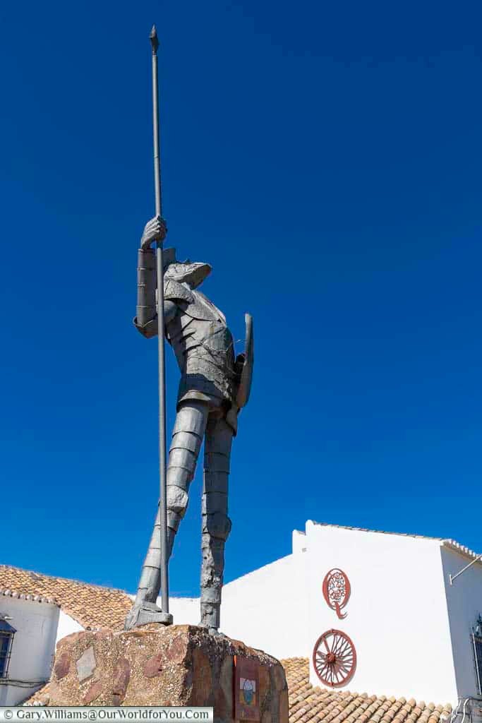 A statue of don quixote looking skyward,holding his lance, in Puerto Lapice, in castile la mancha in central spain