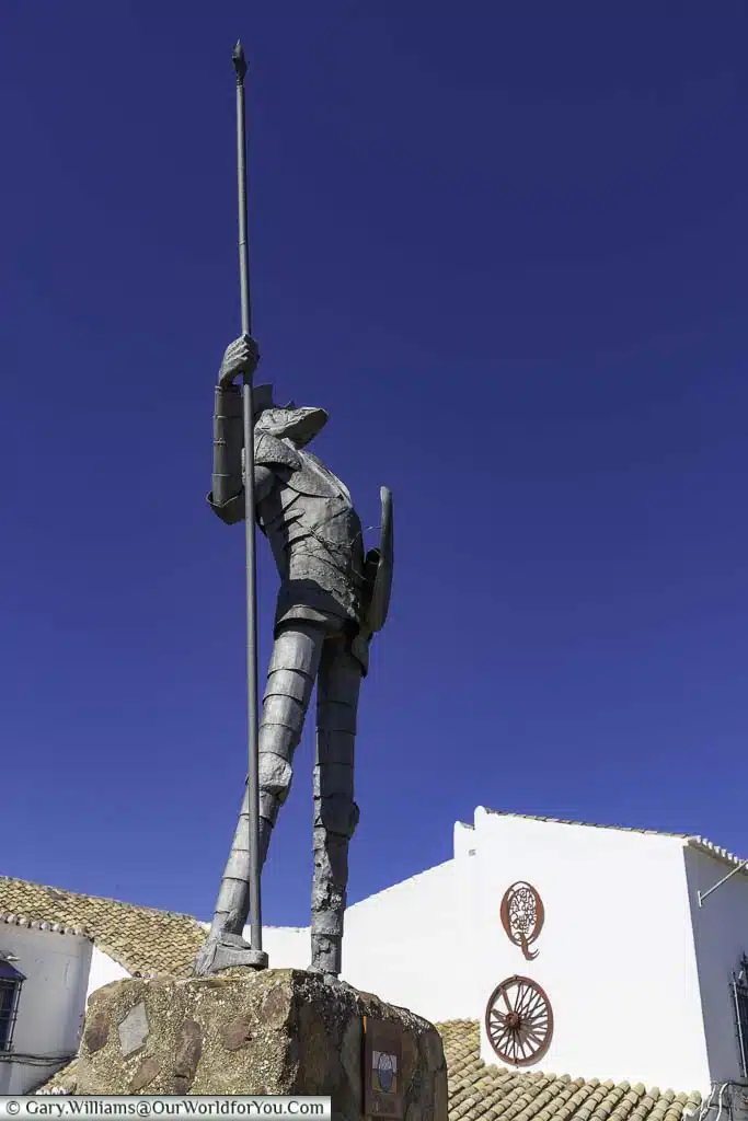 A statue of don quixote looking skyward,holding his lance, in Puerto Lapice, in castile la mancha in central spain