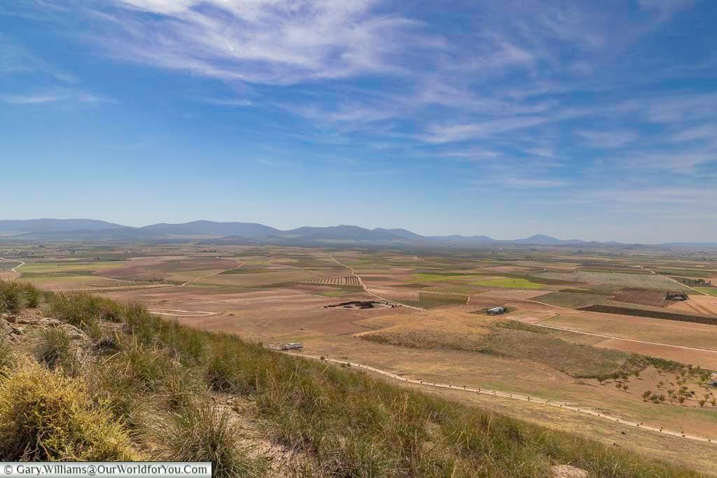 The flat open landscape of la mancha, spain as seen from the windmills in consuegra