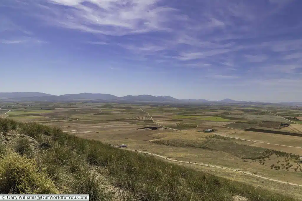 The flat open landscape of La Mancha, Spain as seen from the windmills in Consuegra