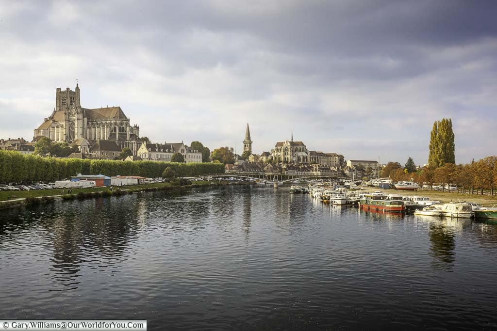 a view of auxerre in france from the pont paul bert across the river yonne to the cathédrale saint-étienne d'auxerre, the town and the quayside