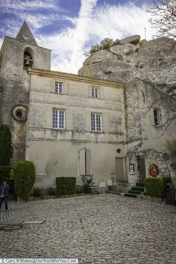 A church tower nestled in between the rocks of les baux-de-provence in the south of france