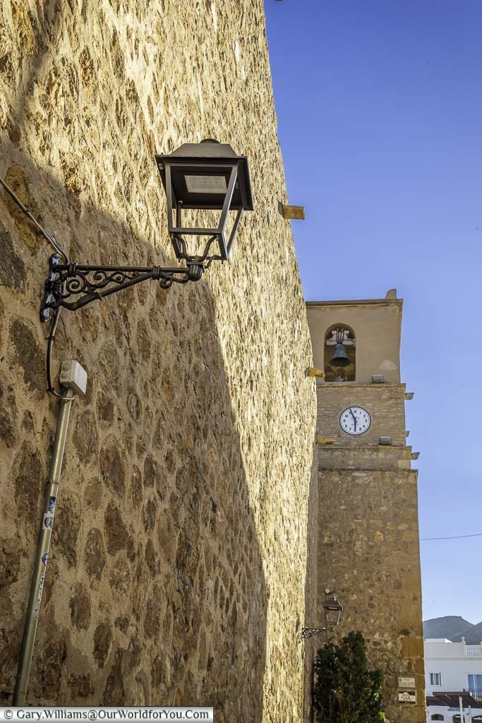The bell tower of the church of santa maria in the old town mojácar, spain
