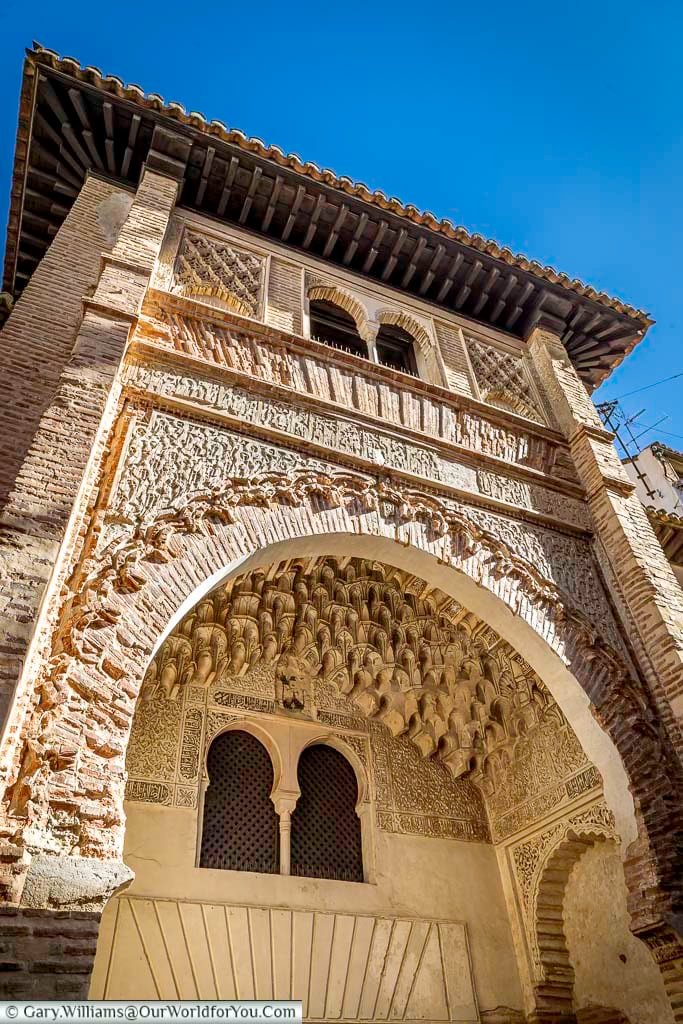 The ornately decorated entrance to corral del carbón in the moorish style in granada, spain